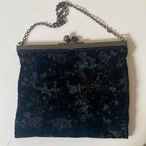 Prada small velvet clutch with tulip kiss lock.